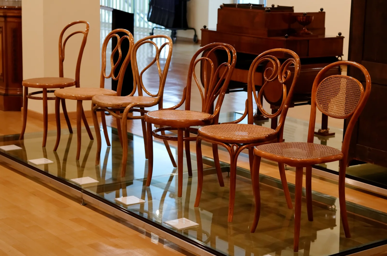 Thonet No. 14 Chair: A bentwood café chair with a circular seat and repeated curved timber parts.